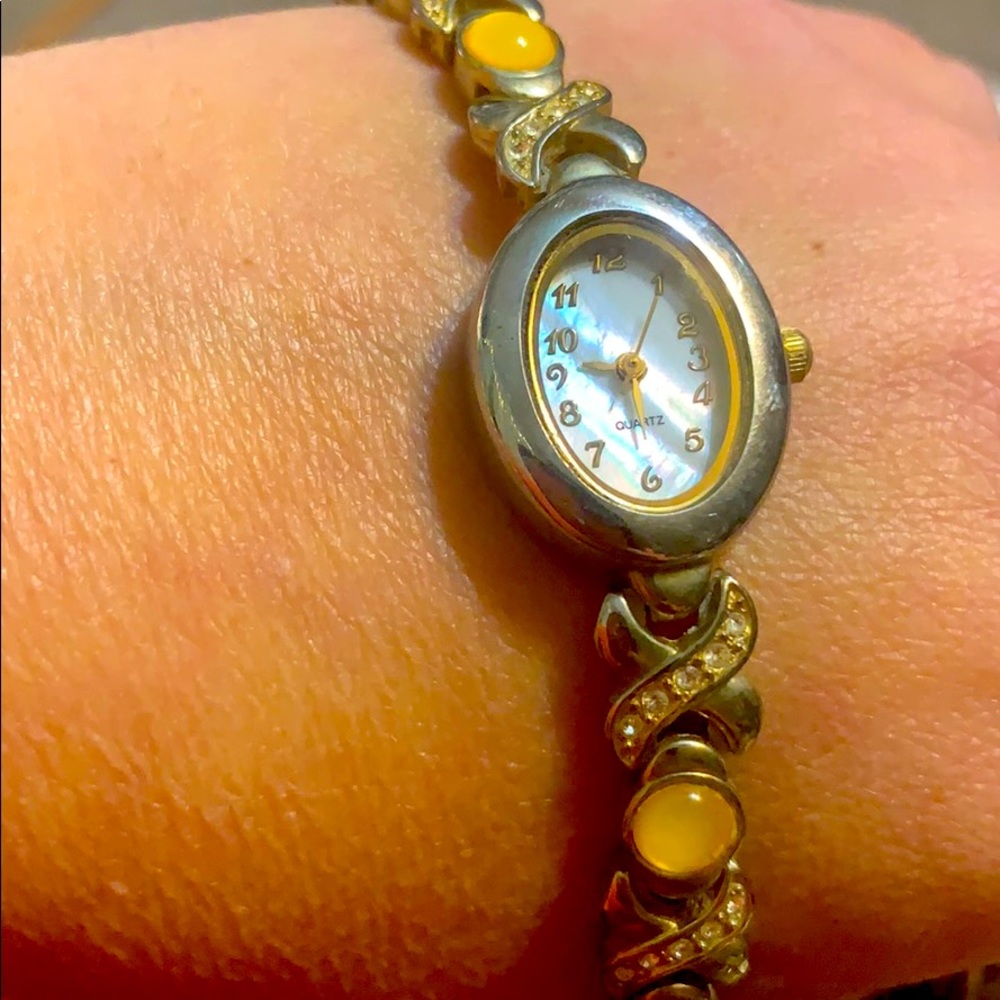 yellow and silverladies watch mother of pearl face